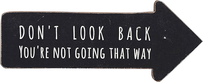 Plaque saying "Don't Look Back, You're not going that way"